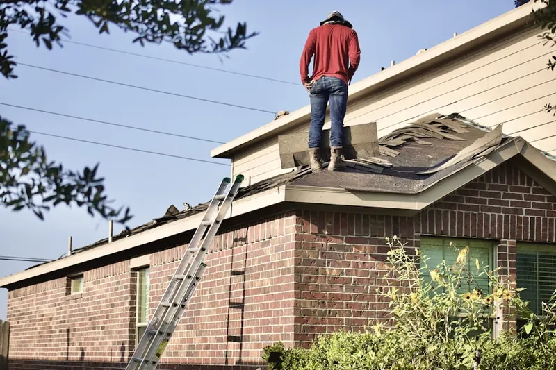 Professional roofer working on a residential roof in Lehman Acres